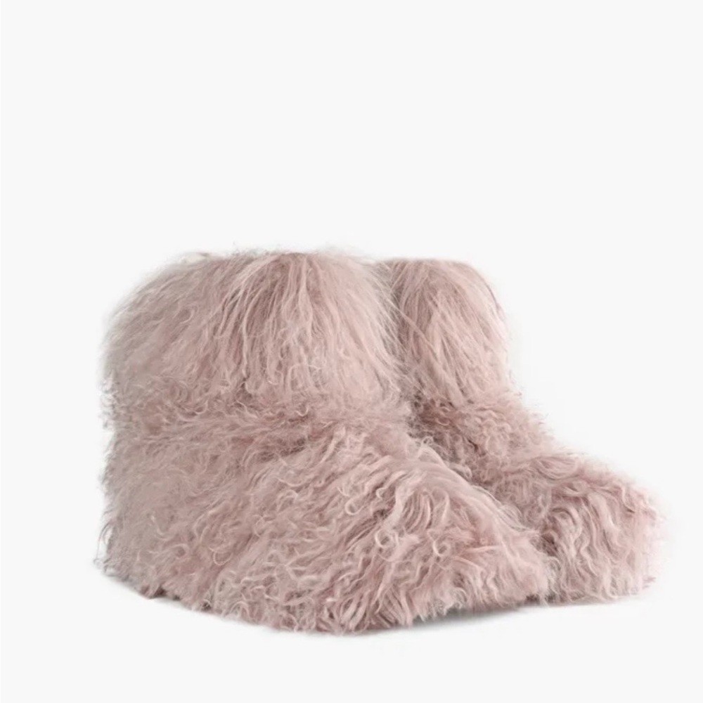 Never worn - Ugg classic short fluff boot.